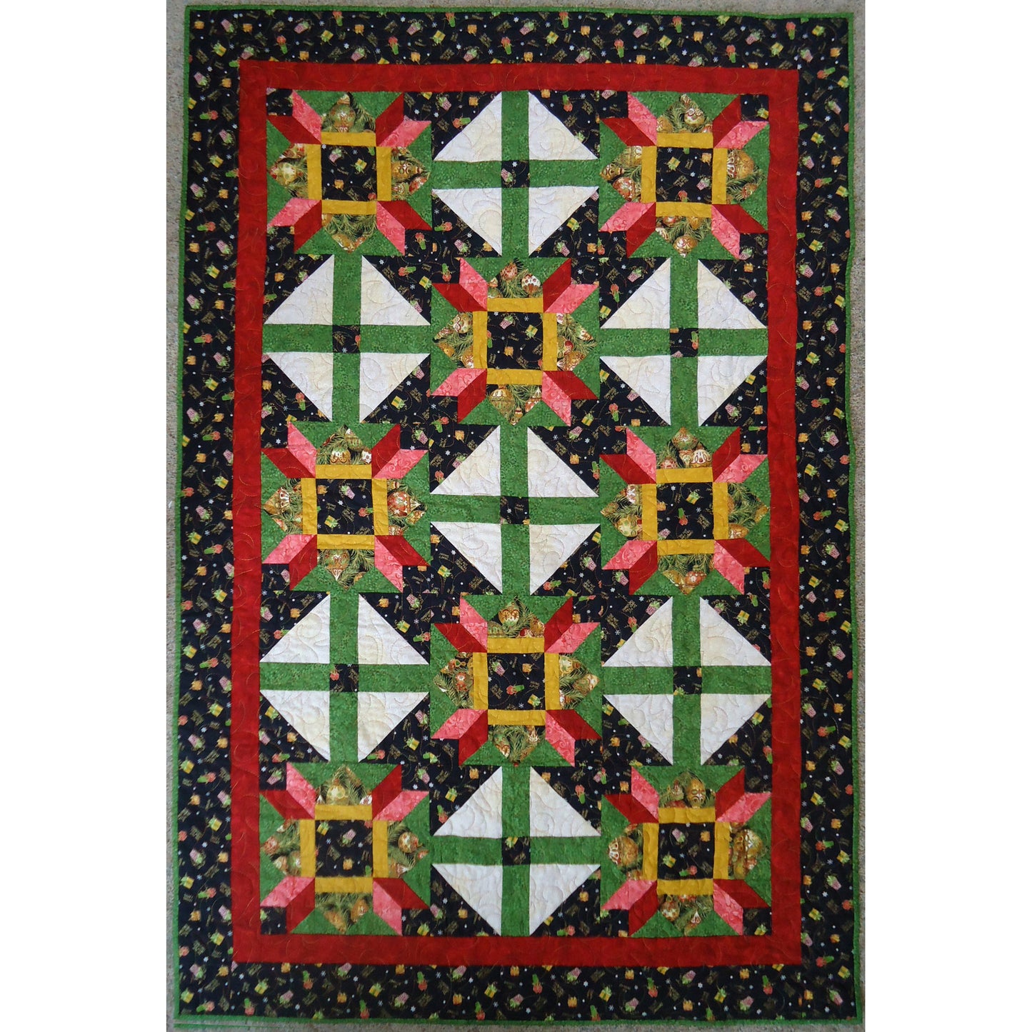 Quilt with geometric pattern on a black background