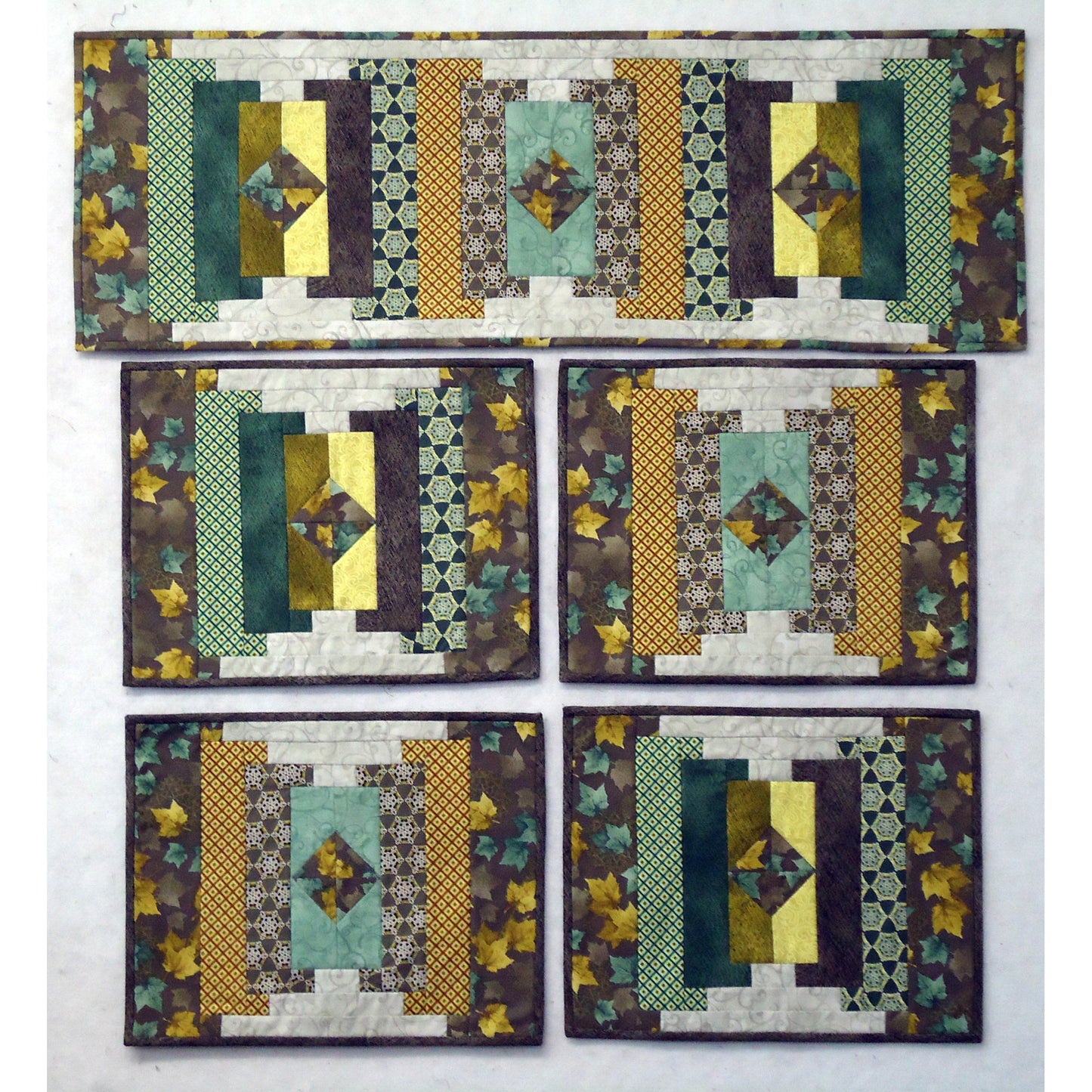 Image of table runner and four matching placemats in fall fabrics.