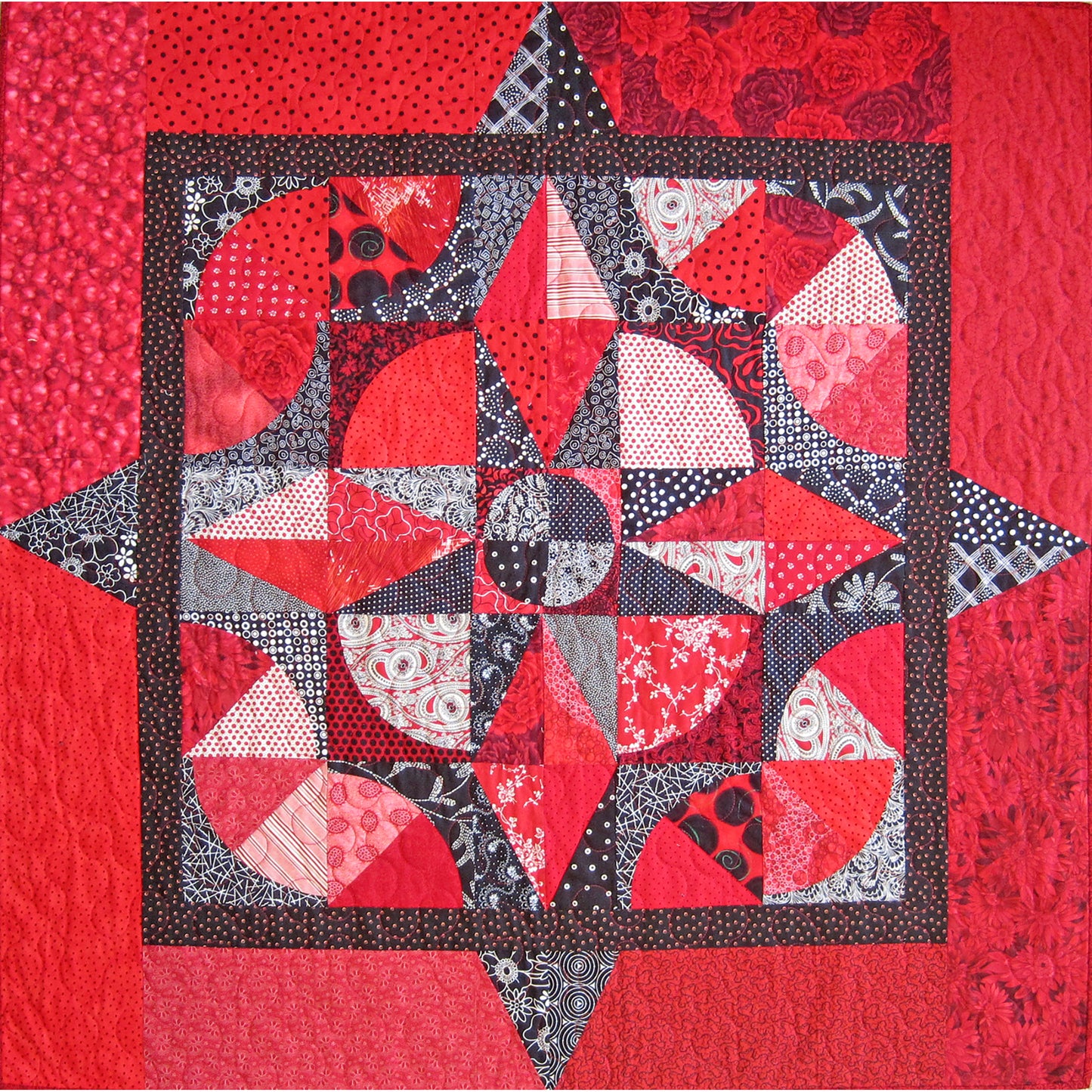 Quilt with geometric pattern on a red background