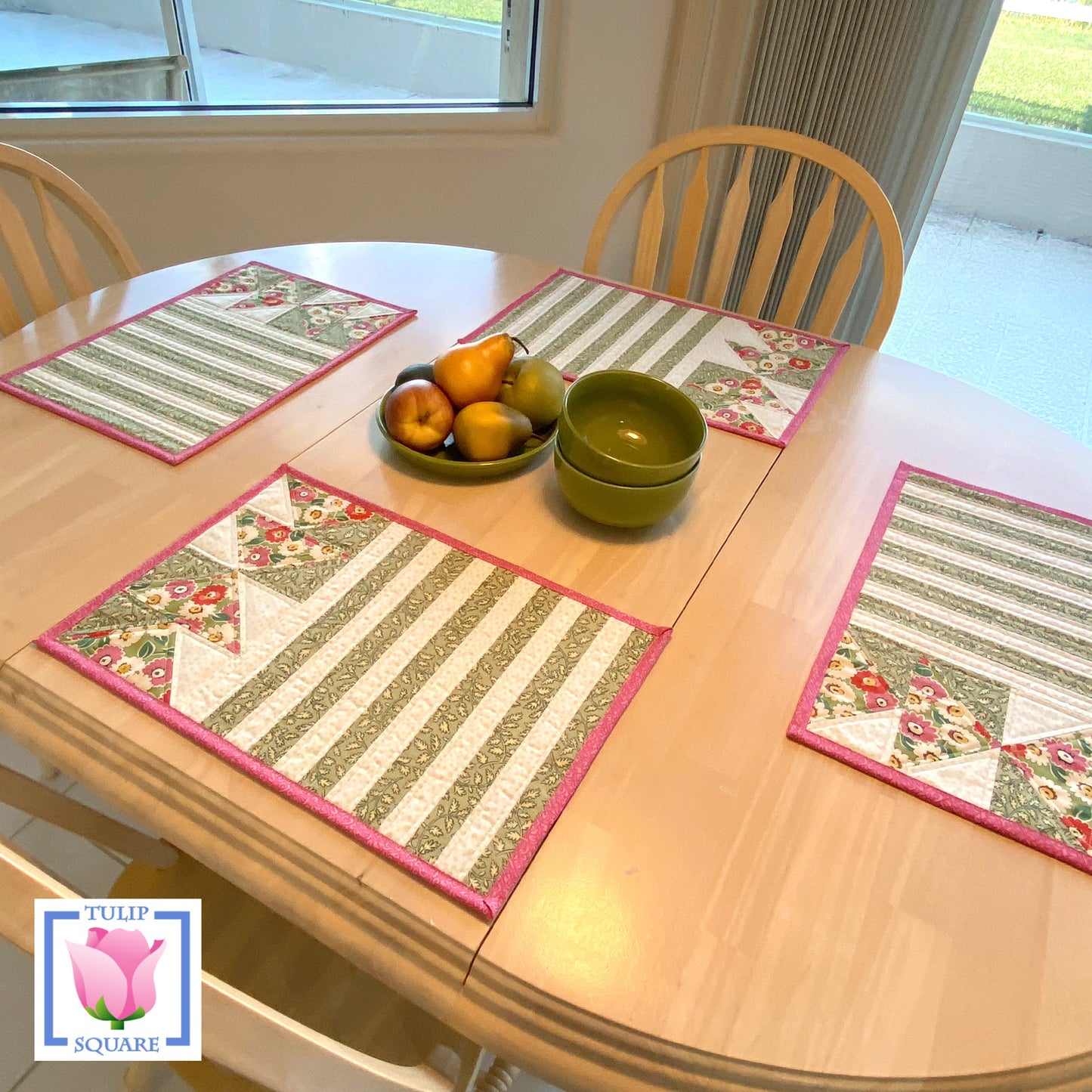 Table set with four placemats that feature strips and diamonds.