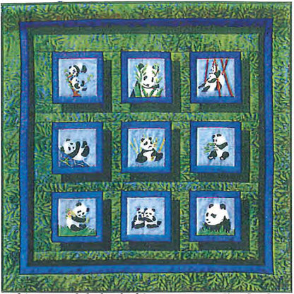 Quilt with panda bear designs on a green and blue background