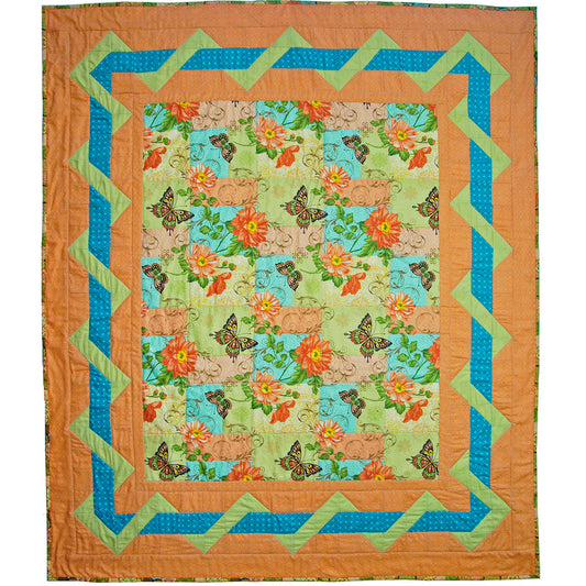 Quilt with butterfly and floral pattern on a white background