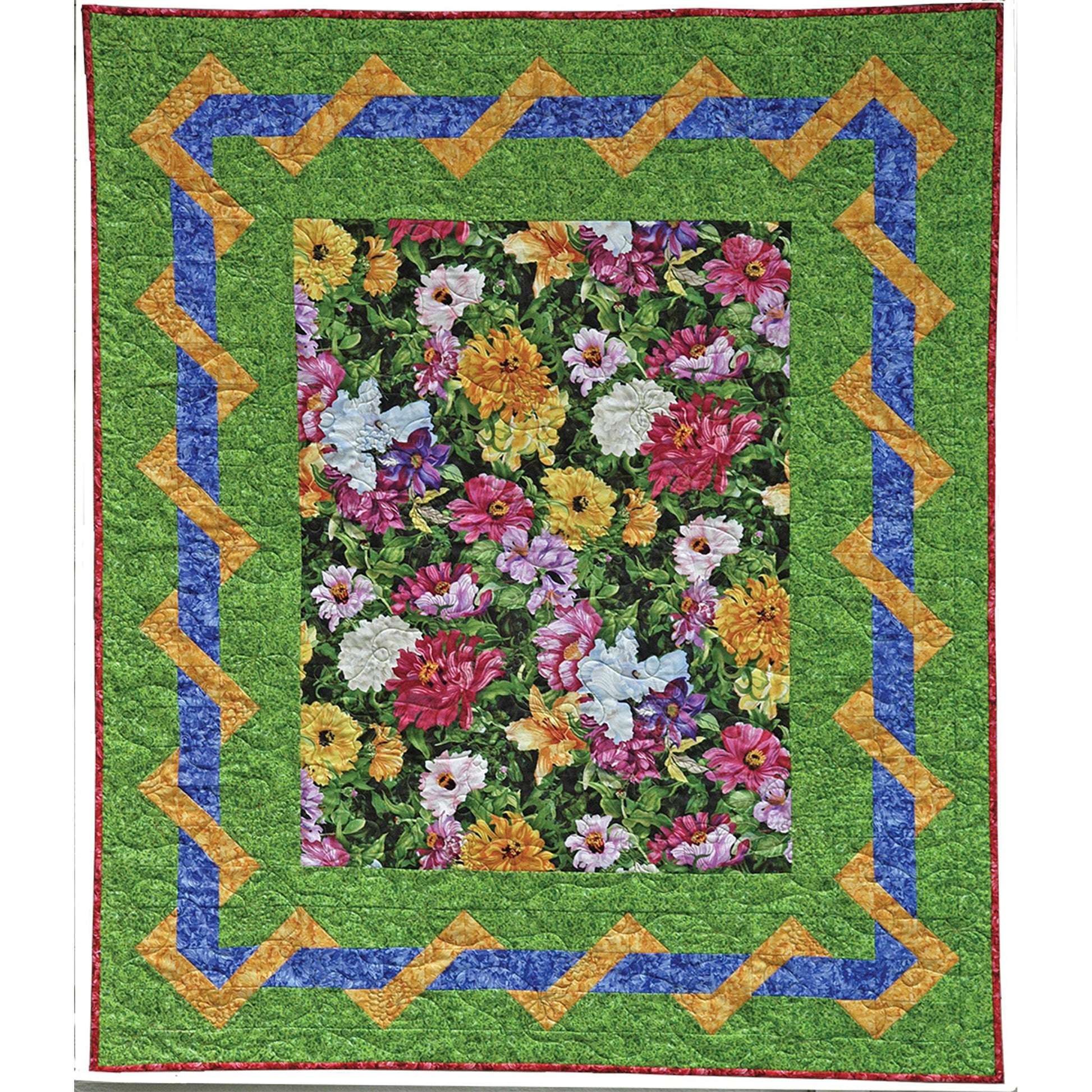 Floral quilt with colorful flowers and a green border on a white background