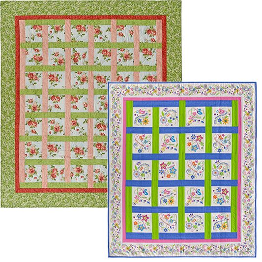 Two floral-patterned quilts with colorful borders on a white background