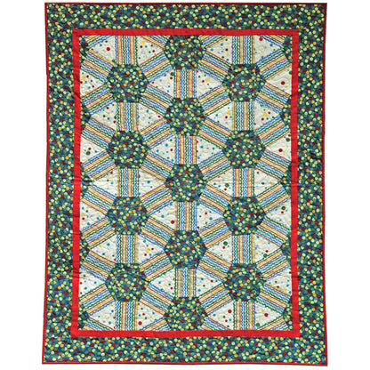 Colorful quilt with geometric pattern on a white background
