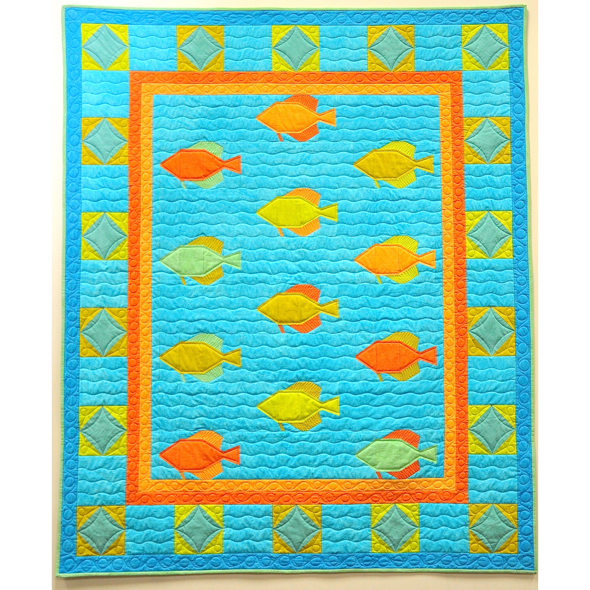 Quilt with fish pattern on a blue background