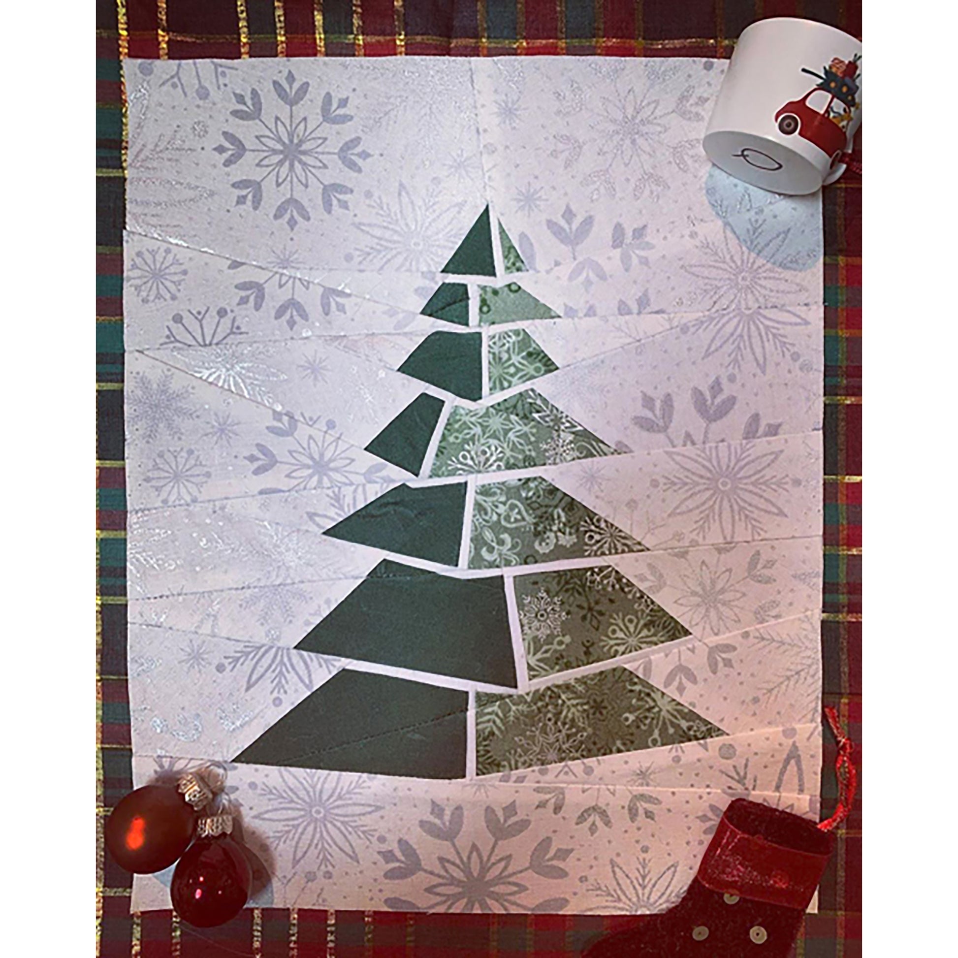 Fun quilt block features a blocky Pine Tree looking like it's stacked with rotating levels.