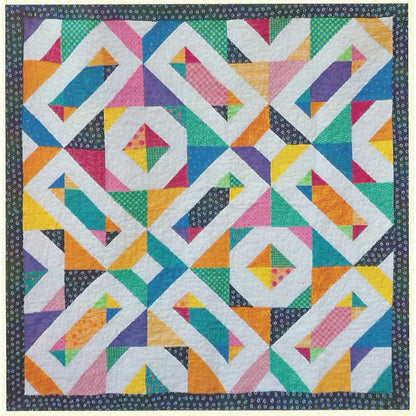 Bright quilt with blocks and triangles of color.