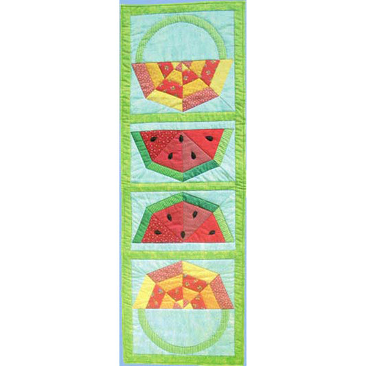 Adorable table runner features watermelons in the middle facing both sides and a patchwork basket with handle.  Perfect picnic table runner.