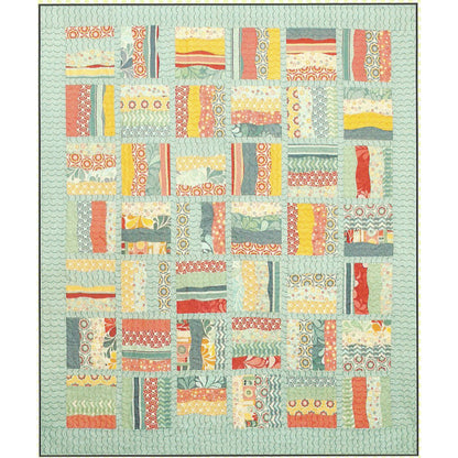 Gentle curves and a layer cake meet up to create this quilt.