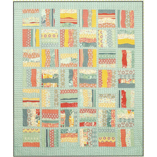 Gentle curves and a layer cake meet up to create this quilt.