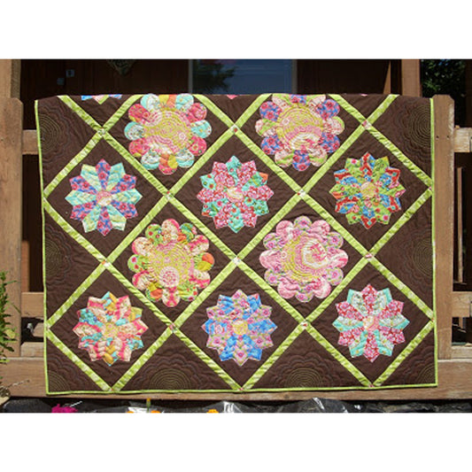 Pretty Dresden plate flowers make this a pretty spring quilt.