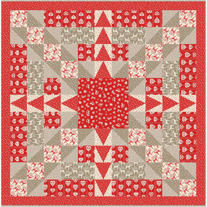 Beautiful star or snowflake quilt using Christmas fabrics mostly in red with some tan.