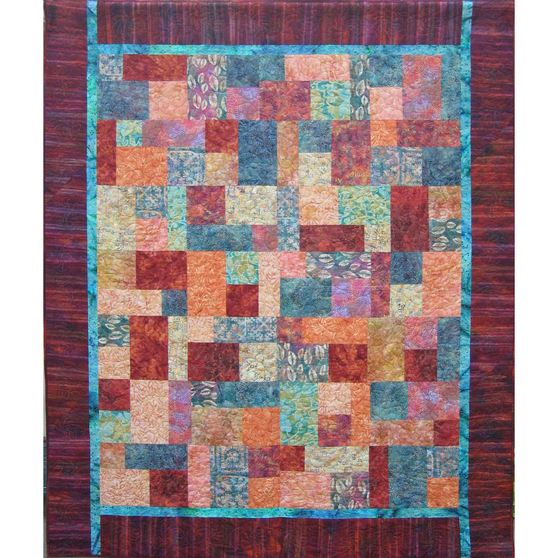 Short Stacks quilt is s a fun square and rectangle quilt with fun fabrics and colors.