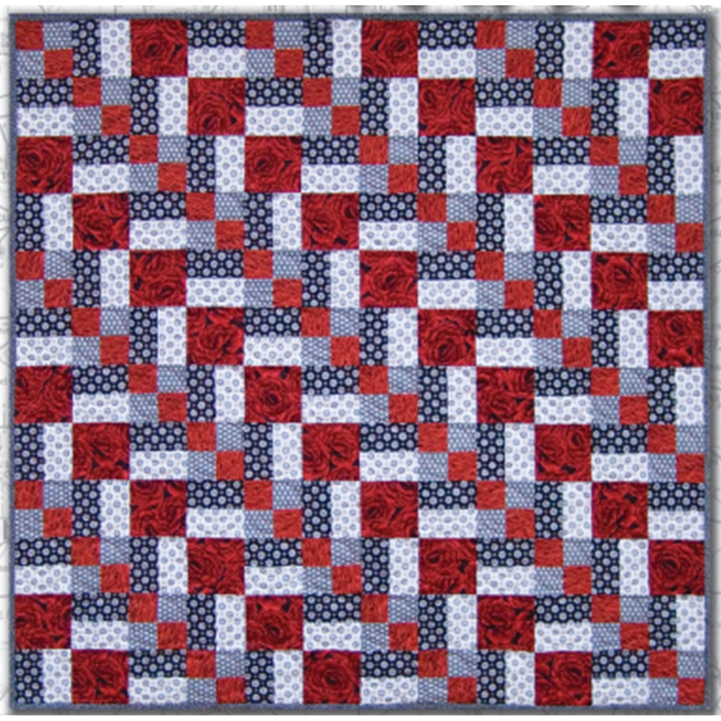 Three color quilt in red, white, and blue features a row of diamonds at a diagonal.  Really pretty and patriotic feeling.