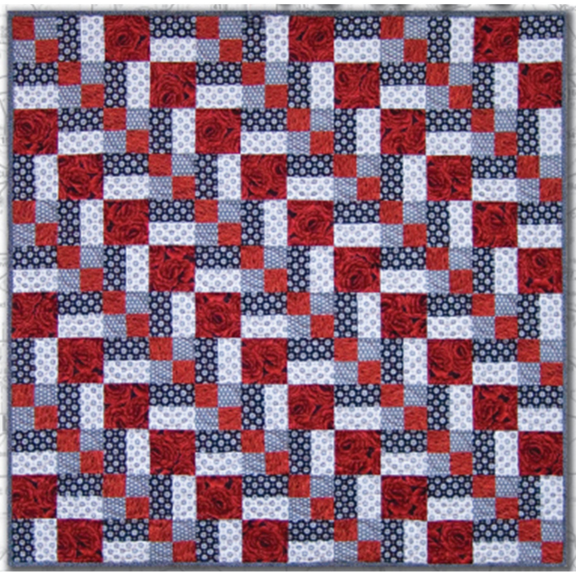 Three color quilt in red, white, and blue features a row of diamonds at a diagonal.  Really pretty and patriotic feeling.