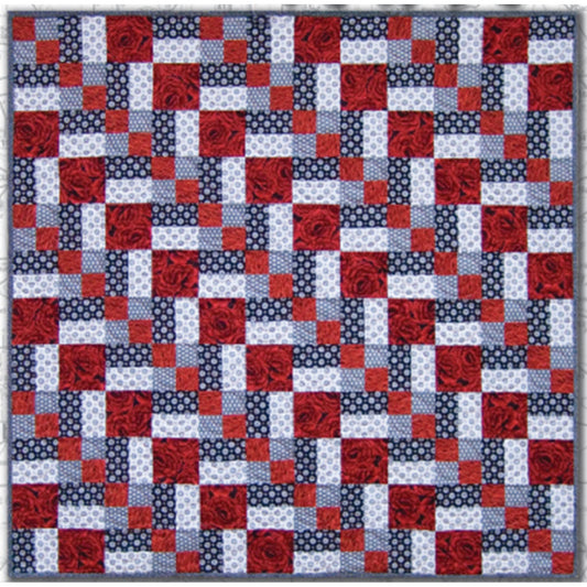 Three color quilt in red, white, and blue features a row of diamonds at a diagonal.  Really pretty and patriotic feeling.