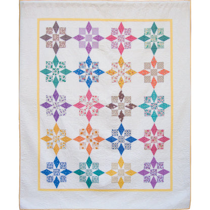 County Fair quilt is a new quilt with that old time look and feel. Fun stars in bright and fun colors parade across the white background fabric.