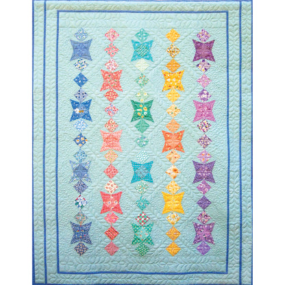 Fun quilt features rows of colorful fabrics. Each row includes a star, and diamonds of fun fabric in similar colors.  Almost like rows of necklaces.