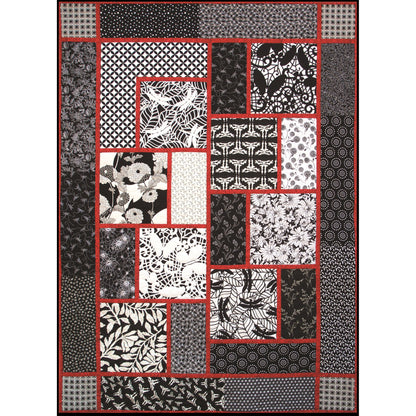 The Big Block Quilt pattern by Black Cat Creations shown in black and white fabrics with red accents.