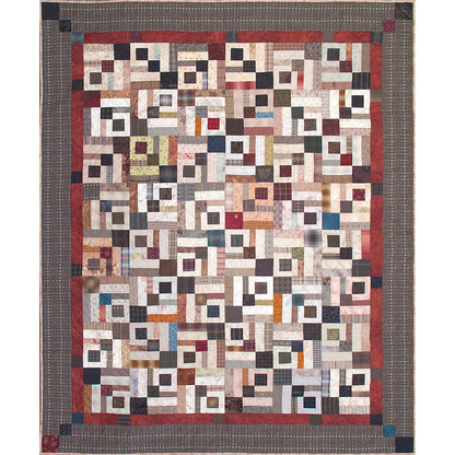 Fun scrappy quilt features darker rows of diamonds which is subtle with the colorful squares and rectangles.