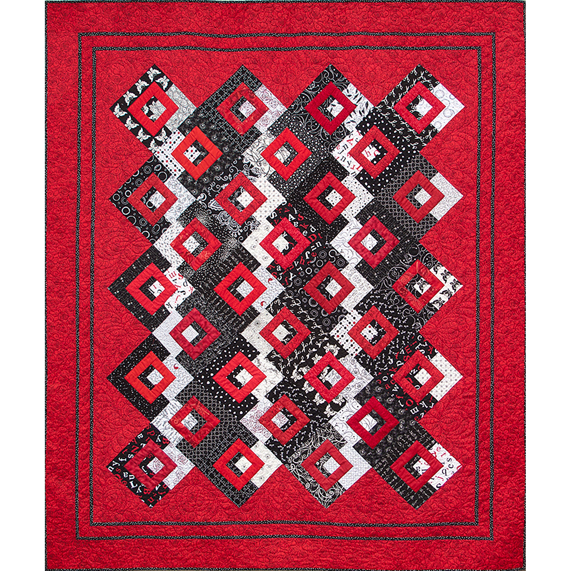 Bright quilt features red background and popping red diamonds on a black and white fabric middle of rows of diamonds.