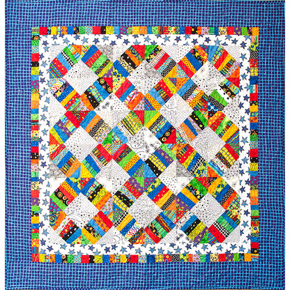 Fun interweaving circles of scrappy fabric quilt.