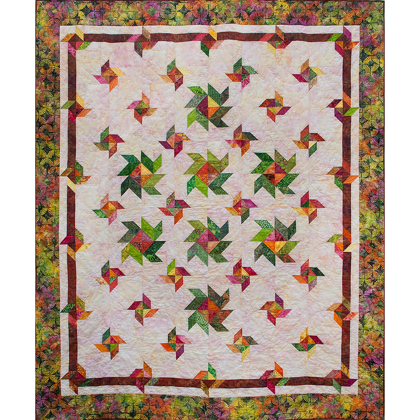 Wingdings quilt is a fun spattering of different sized pinwheel like flowers across a neutral backgroun fabric.