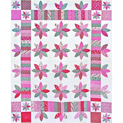Zu Zu's Petals is an updated version of a vintage 1930's quilt Jackie found on an antiquing trip to Rountop, Texas. Includes flowers with different colored petals in pinks.