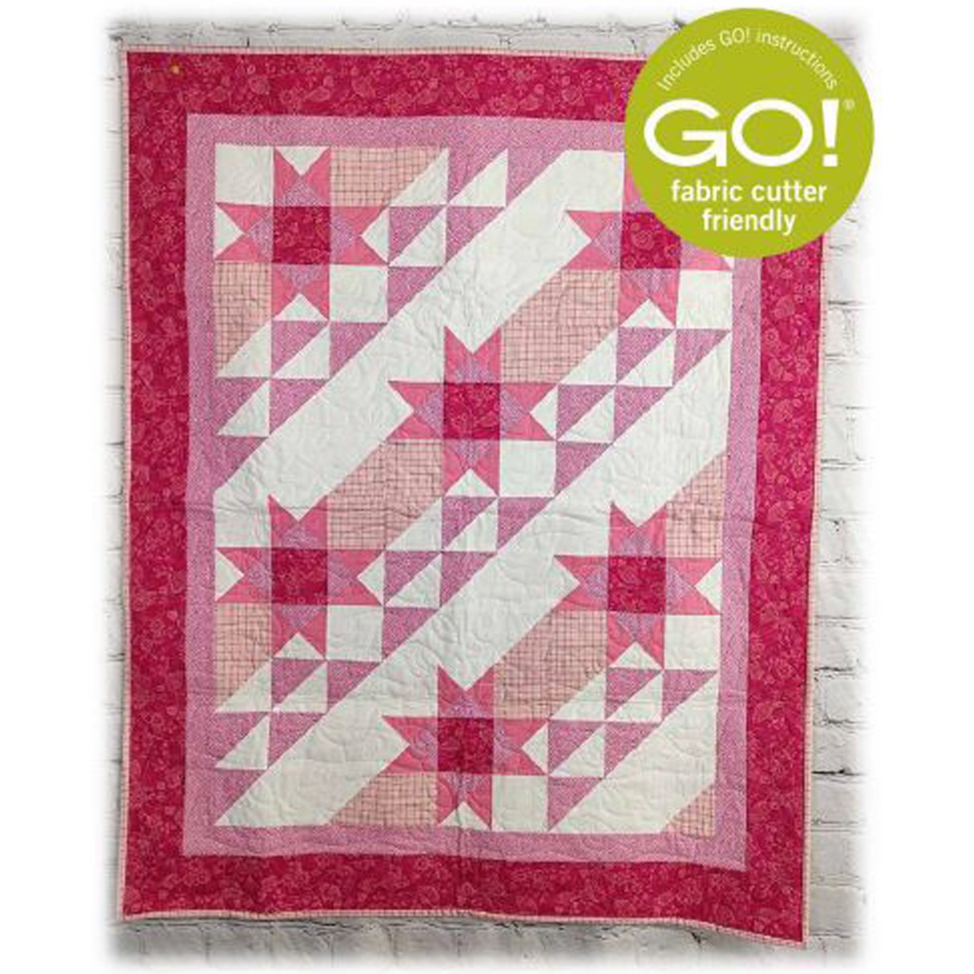 Beautiful quilt in pinks in diagonals of stars and broken stripes.
