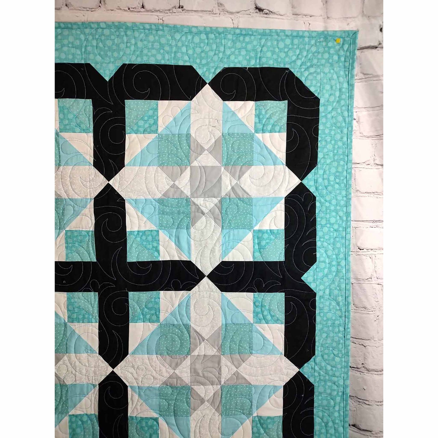 Image shows Handy Man quilt corner so you can appreciate the quilted design.