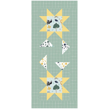 A green and yellow table runner featuring a star pattern. This one includes outdoor print in the middle of the stars.