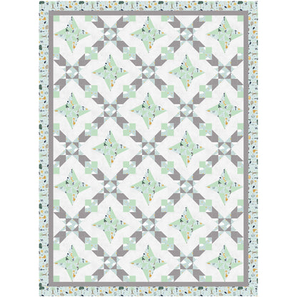 A geometric quilt featuring a harmonious blend of green and gray patterns.