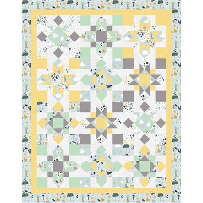 A yellow and gray quilt featuring a green and white design of different stars and 4-patch squares.