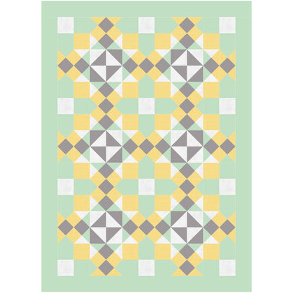 A quilt featuring a pattern of yellow, green, and gray squares arranged in a harmonious design.