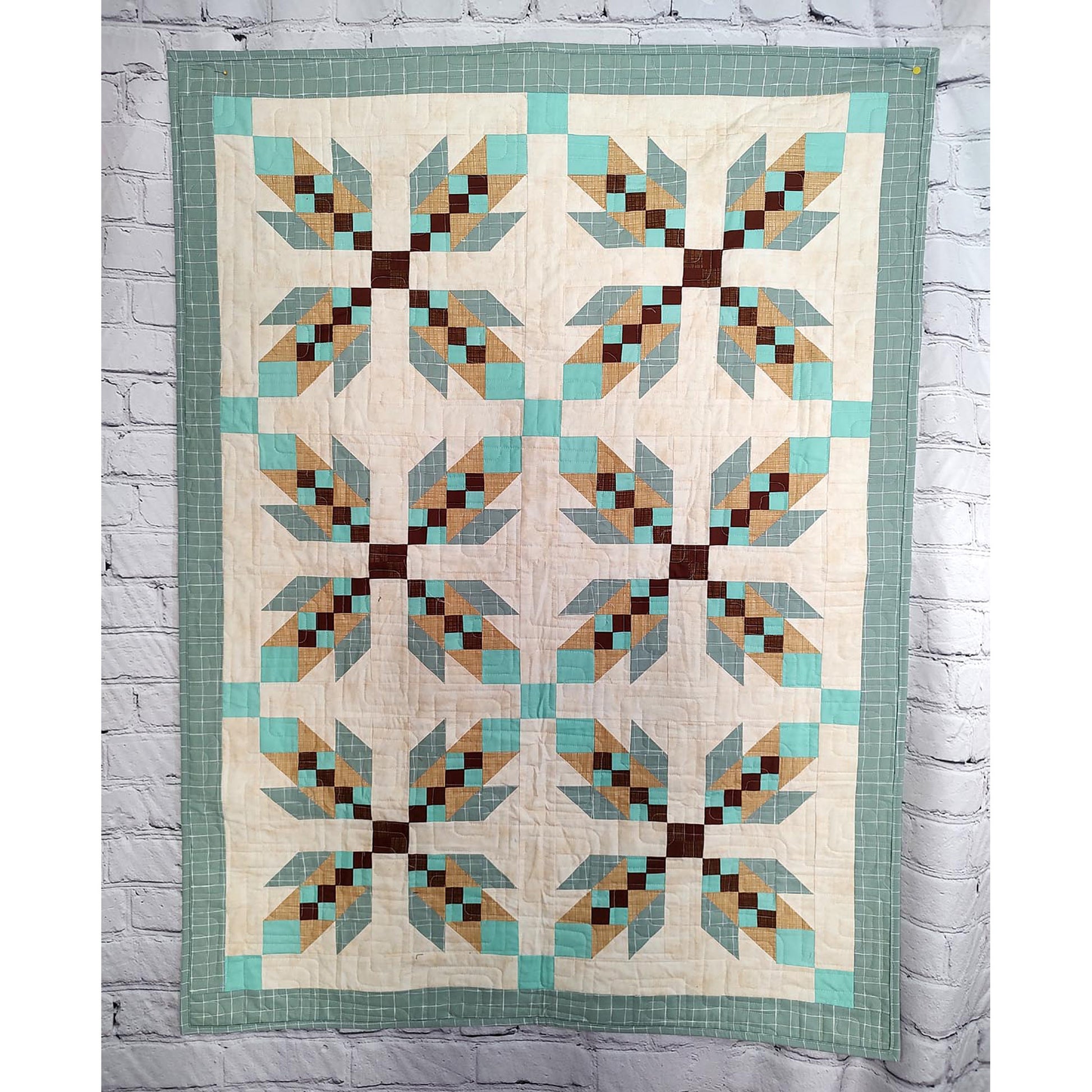 Quilt features X's of what look like feathers to represent bear hugs.