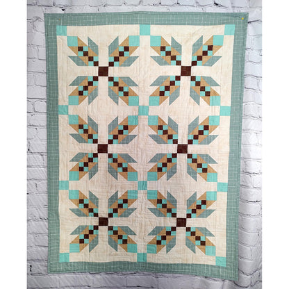 Quilt features X's of what look like feathers to represent bear hugs.