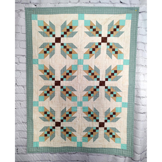 Quilt features X's of what look like feathers to represent bear hugs.