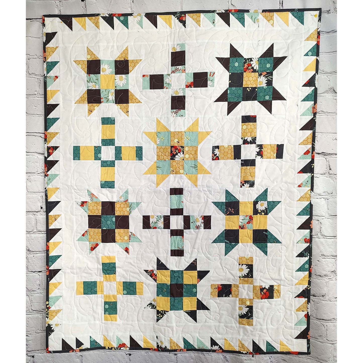 Fun quilt features blocks of Ohio stars with extra fun nine patch inside and plus signs. 