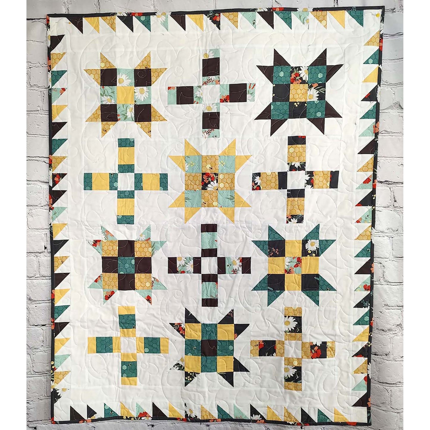 Fun quilt features blocks of Ohio stars with extra fun nine patch inside and plus signs. 