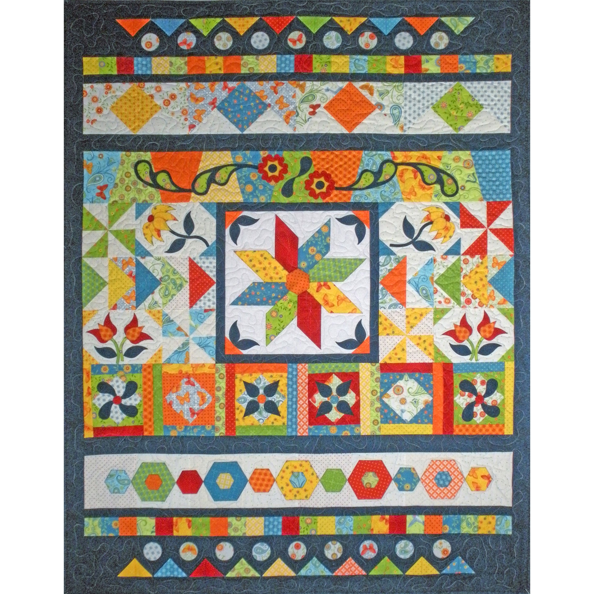Colorful quilt with geometric and floral patterns on a dark background
