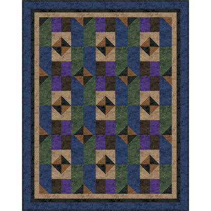 Quilt with geometric pattern in blue, green, and brown on a white background