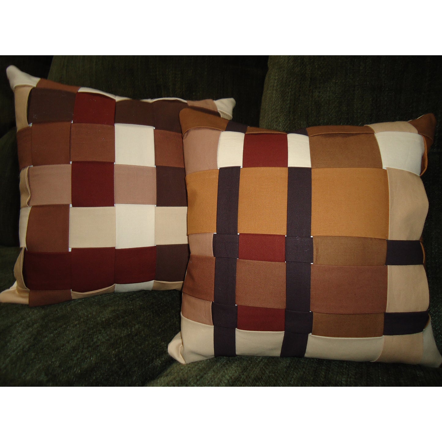 Two woven patterned pillows on a dark surface