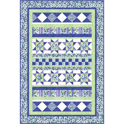 Quilt with blue and green patterned fabric on a white background