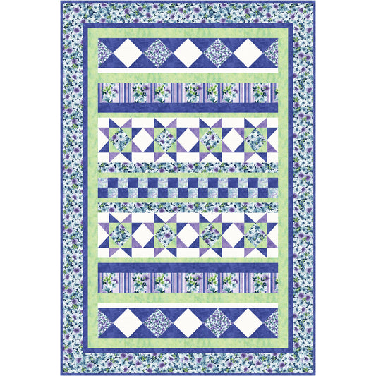 Quilt with blue and green patterned fabric on a white background