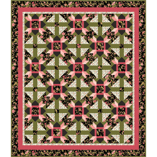 Quilt with geometric pattern in green, pink, and black on a white background