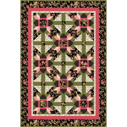 Quilt with geometric pattern and floral border on a white background