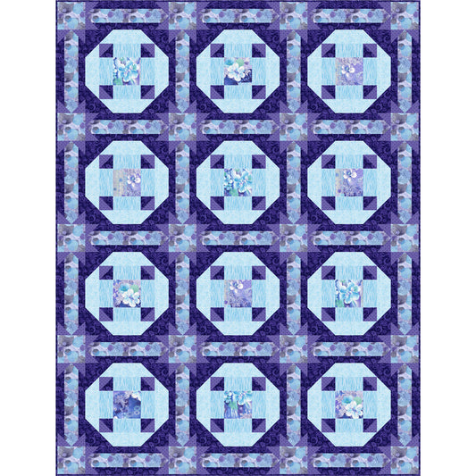 Quilt with blue and purple geometric pattern on a white background
