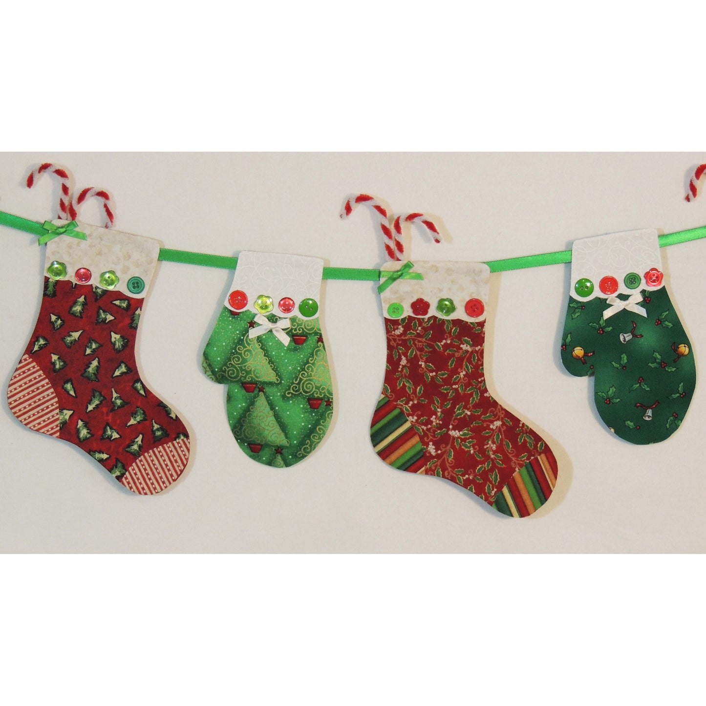 Stockings and Mittens Garland in Christmas fabrics shown in a close-up image.