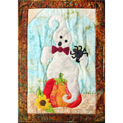 Adorable quilt features a ghost who is a little frightened by the spider sitting on its' arm. The ghost is sitting on a pumpkin with a sunflower.